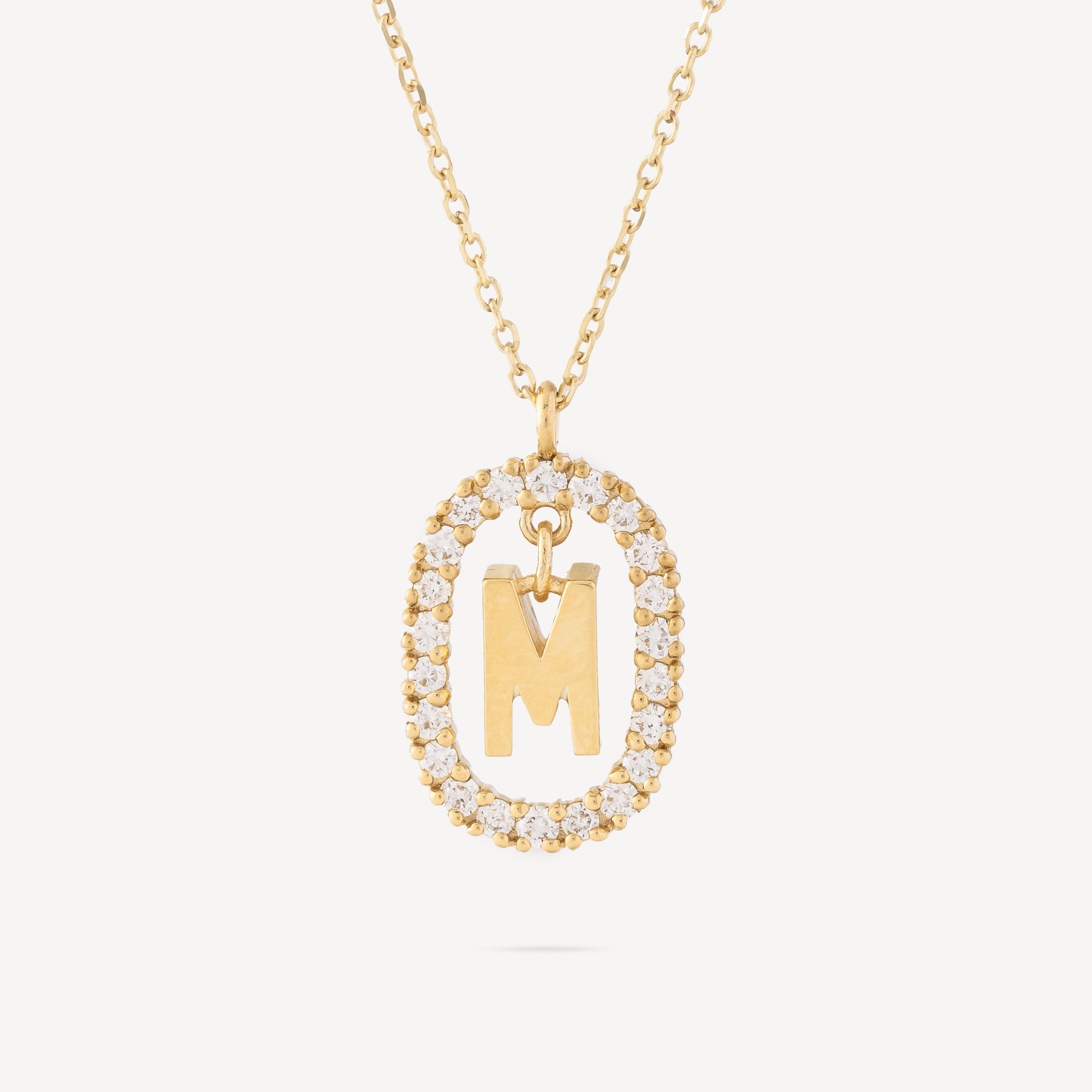 Letter M gold diamond necklace